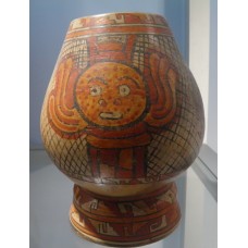 Polychrome Papagayo, winged disc with face